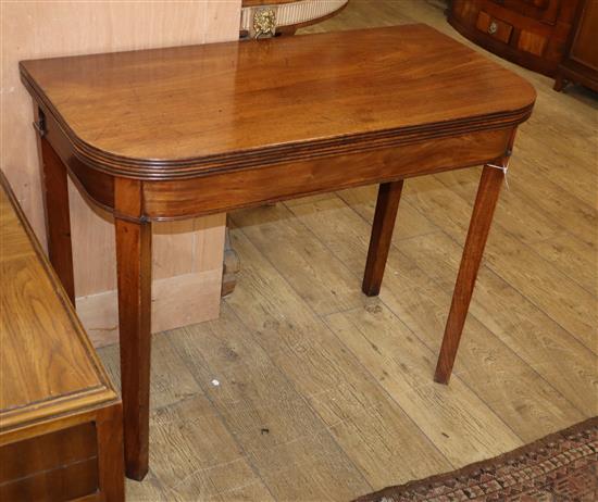 A George III mahogany folding tea table W.92cm